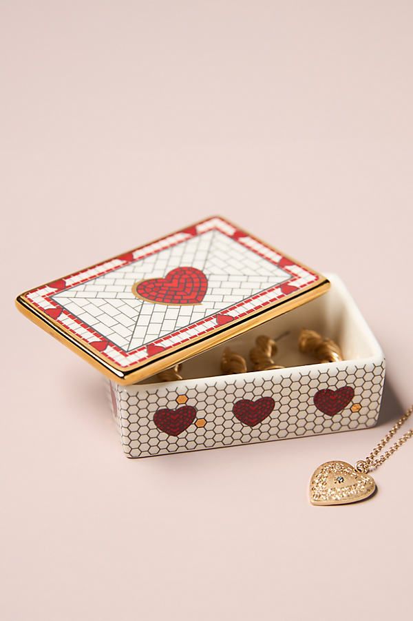 white box with heart on the pink background