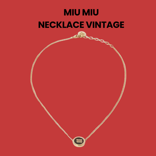 Gold Miu Miu vintage necklace with circular logo pendant on red background.
#MiuMiuVintage #DesignerJewelry #MinimalistNecklace #LuxuryAccessories #ItalianFashion #TimelessStyle #GoldPendant #FashionCollectible #MiuMiuStyle