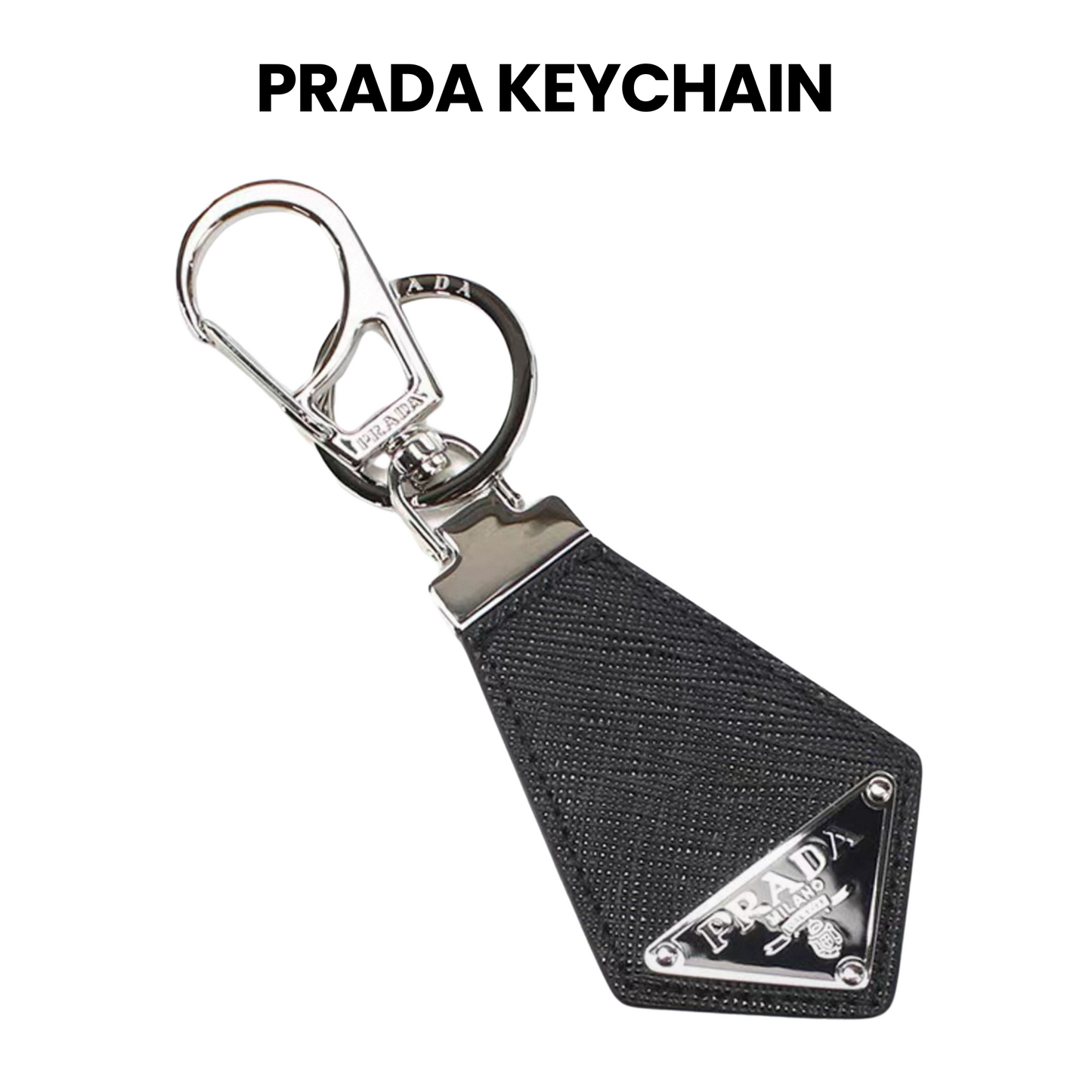 Prada keychain with black fabric tag and silver hardware on a white background, boss gift, men gift, birthday gift, surpriseboxgift.com