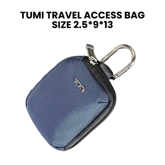 TUMI travel access bag with carabiner on a white background