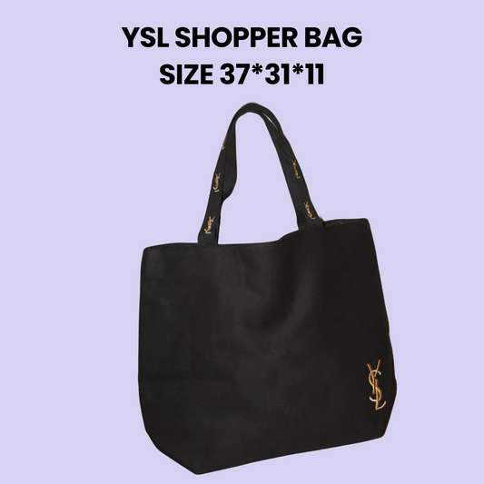 Black YSL shopper bag with gold logo embroidery and branded handles, displayed on a lavender background with size dimensions.
#YSLBag #SaintLaurent #DesignerTote #LuxuryFashion #BlackShopperBag #MinimalistStyle #FashionEssentials #YSLStyle #EverydayLuxury #BrandedBag