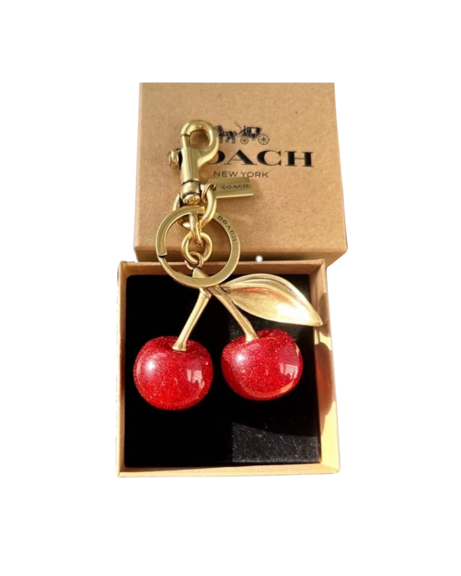 coach Gold keychain with red cherries in a Coach box. surpriseboxgift.com, ideas for gifts for man and woman, corporate gift, luxury gift box, chrismas gift, birthday gift
