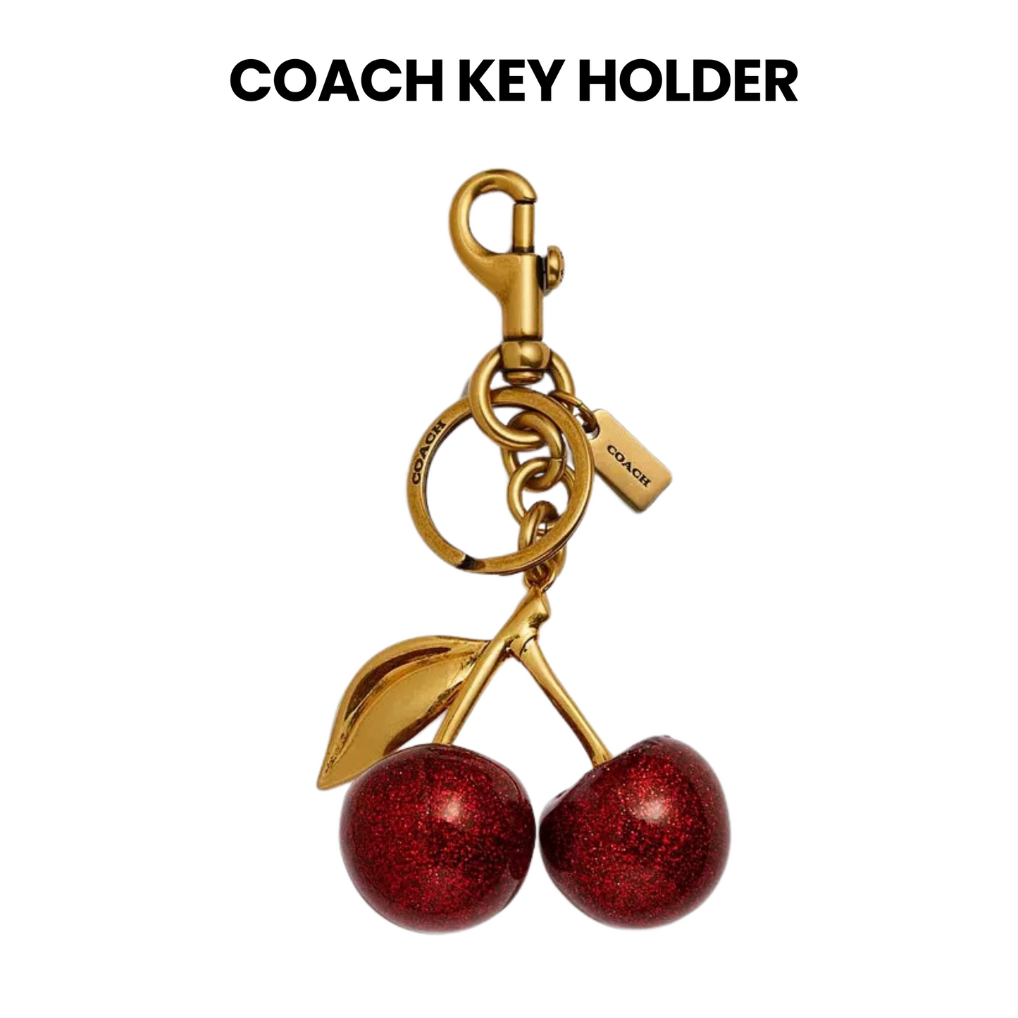 coach Gold keychain with red cherries in a Coach box. surpriseboxgift.com, ideas for gifts for man and woman, corporate gift, luxury gift box, chrismas gift, birthday gift,